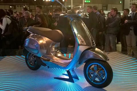 Vespa shock Milan with Elettrica scooter