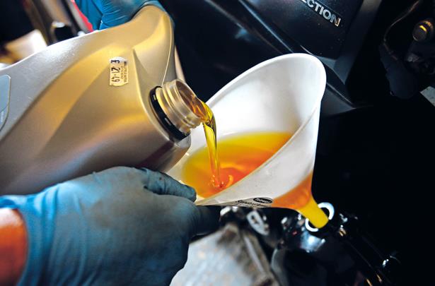 Slick operation! How to change your motorbike oil and filters  MCN