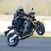 2021 Yamaha MT-09 SP doing what it does best, with Michael Neeves pulling a huge wheelie on a runway
