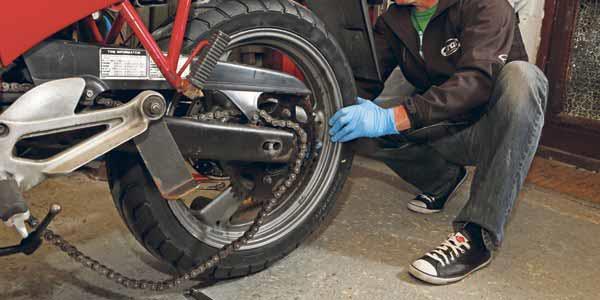 Loosen the chain adjusters a couple of turns Loosen the chain adjusters a couple of turns