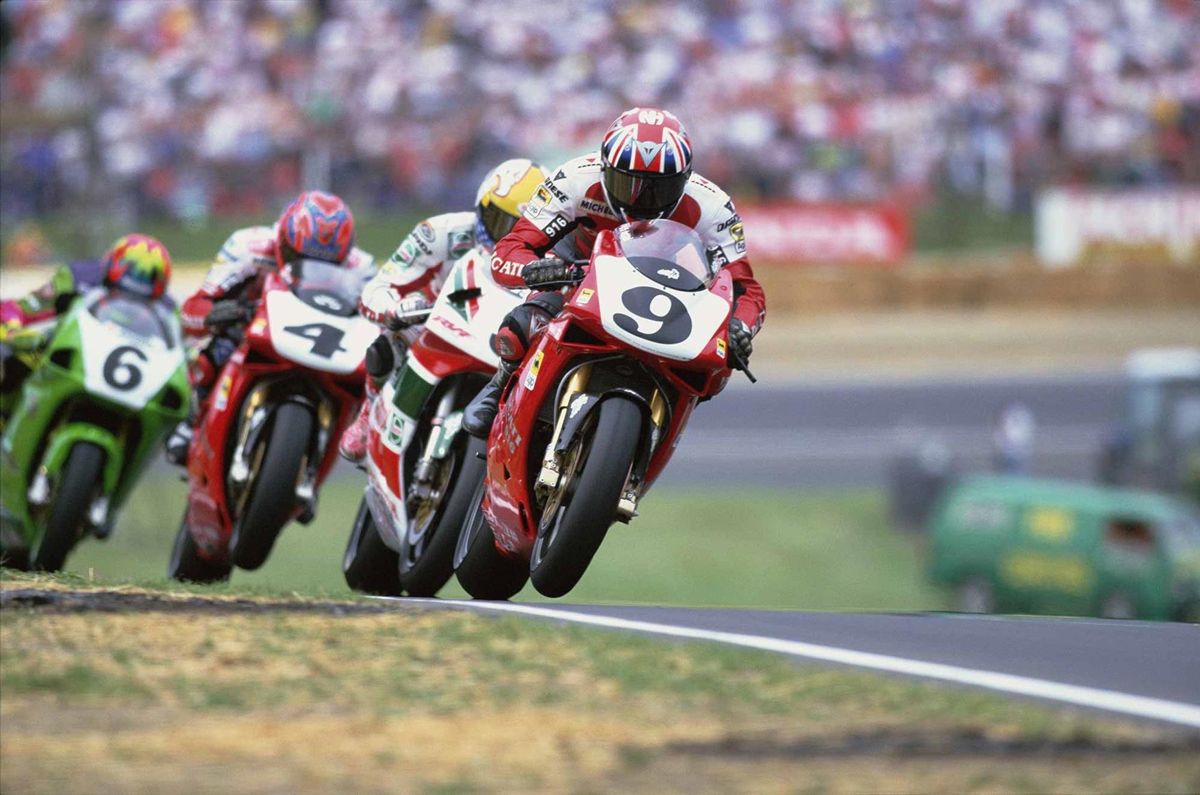 Neil Hodgson (number nine) leads Simon Crafar (number six) Neil Hodgson (number nine) leads Simon Crafar (number six)