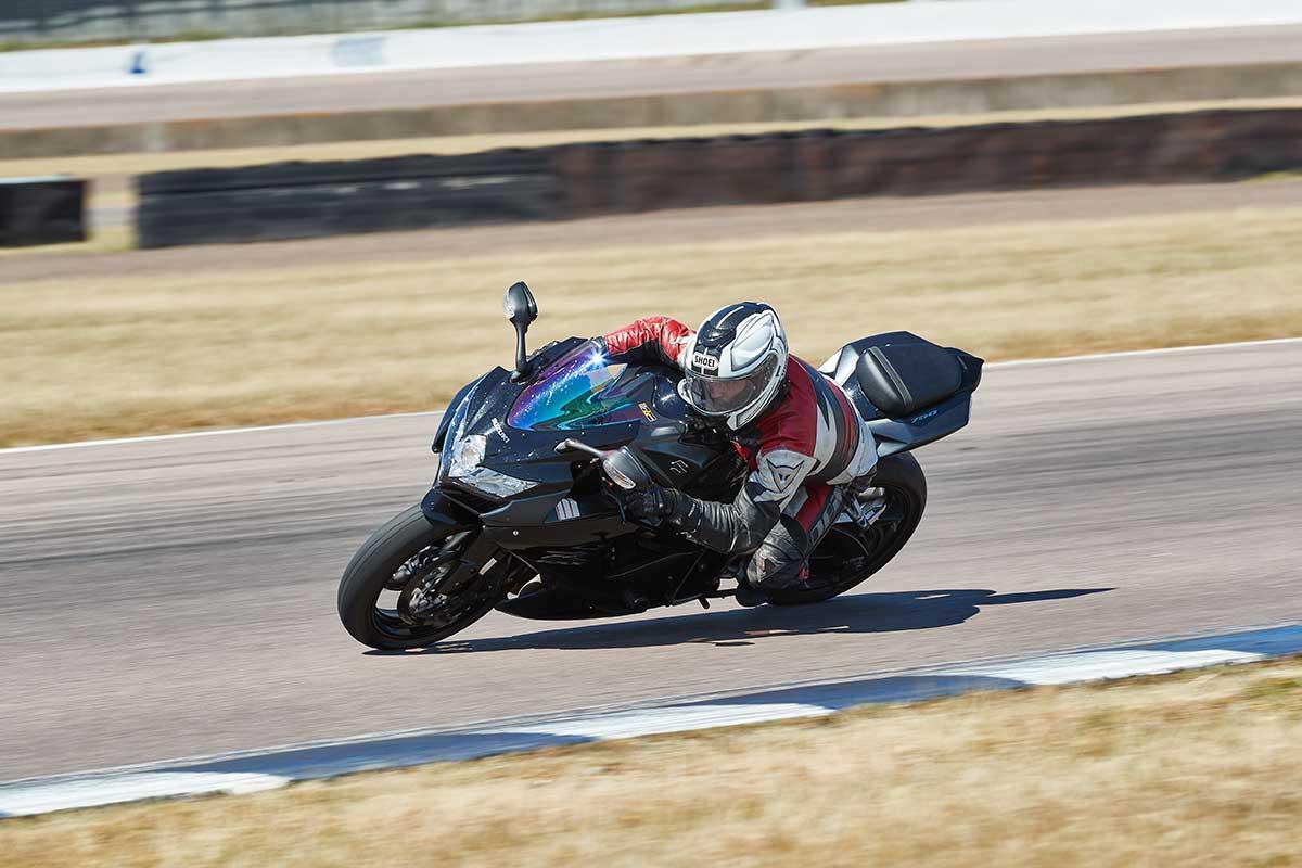 Hang off the bike to turn tighter without increasing lean angle Hang off the bike to turn tighter without increasing lean angle