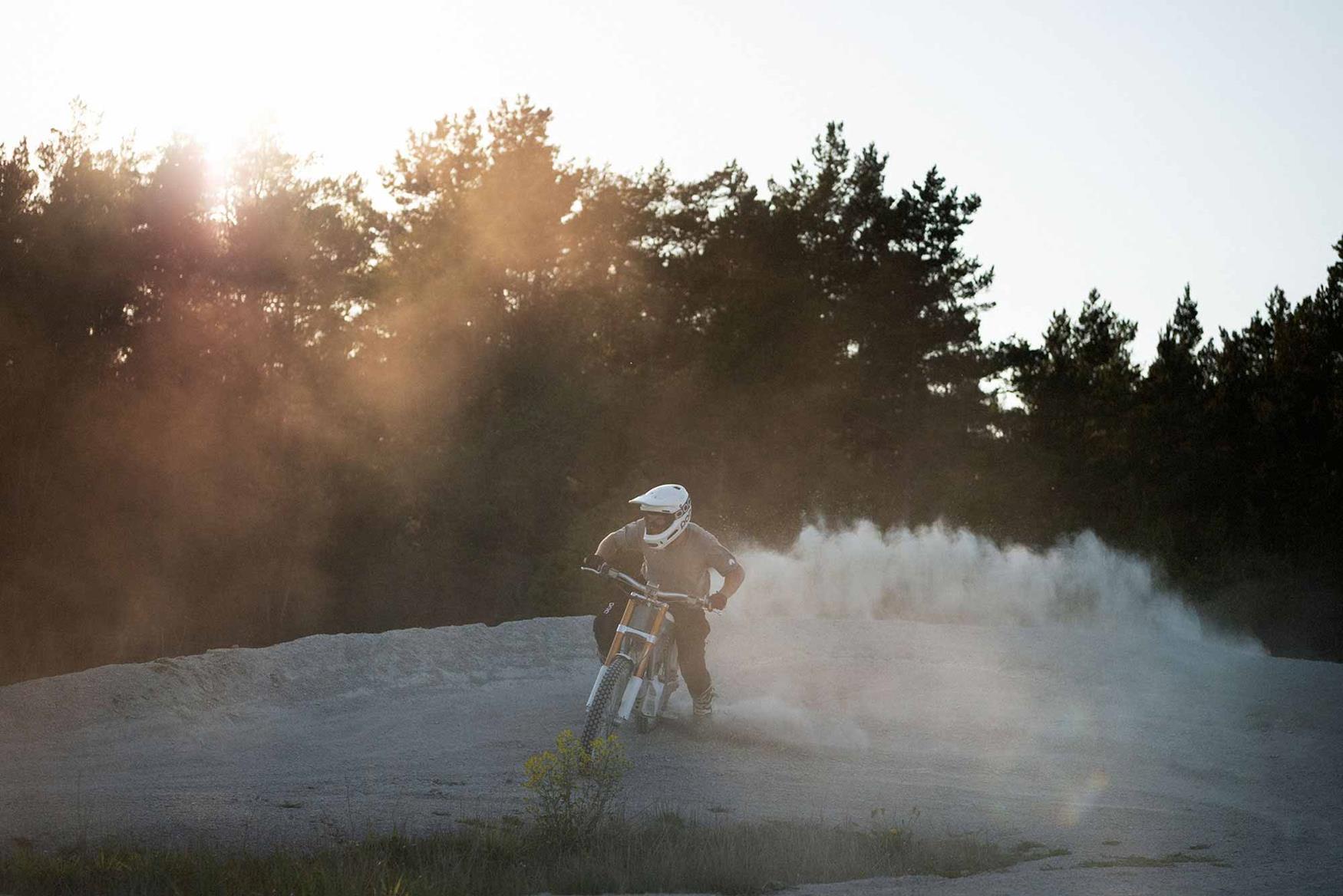 A Cake bike rooster tails its way around a turn A Cake bike rooster tails its way around a turn