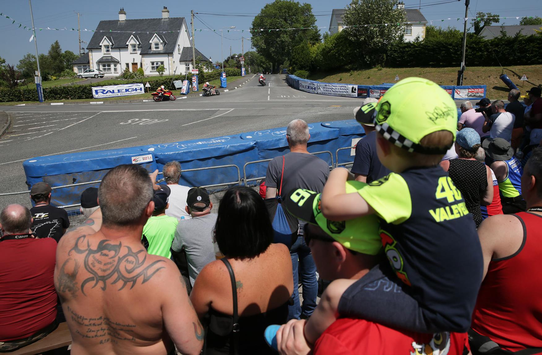 The crowds are crucial to the success of road race meetings The crowds are crucial to the success of road race meetings