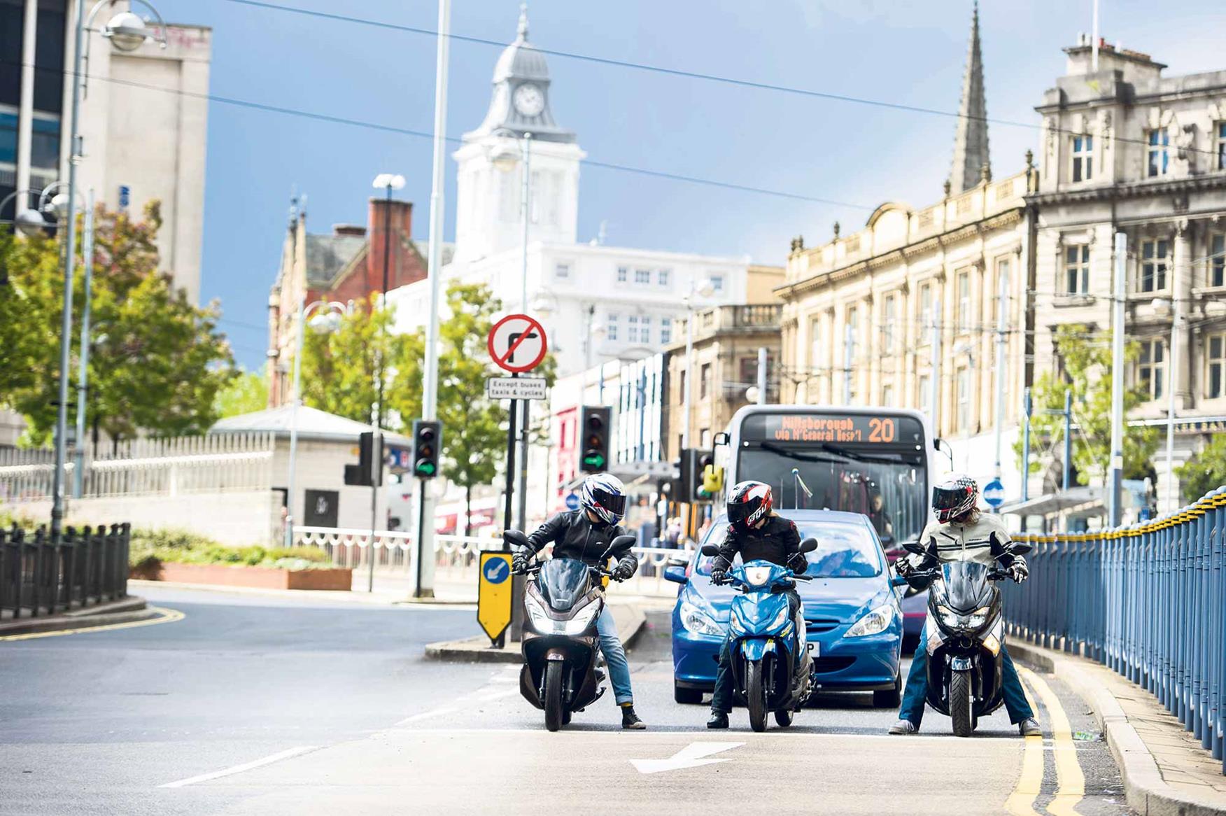 The Honda PCX125 queues at the lights with some of its rivals The Honda PCX125 queues at the lights with some of its rivals