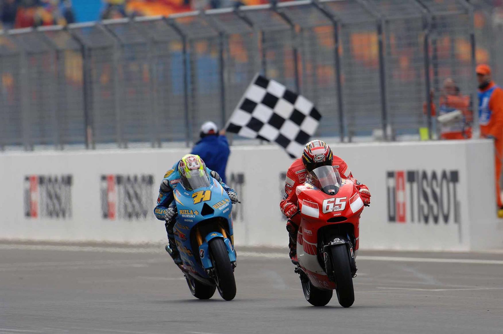 Following the Ducati of Capirossi across the line Following the Ducati of Capirossi across the line