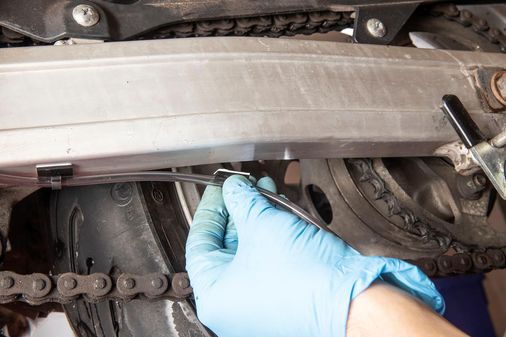 Make sure the swingarm is clean before you stick Make sure the swingarm is clean before you stick