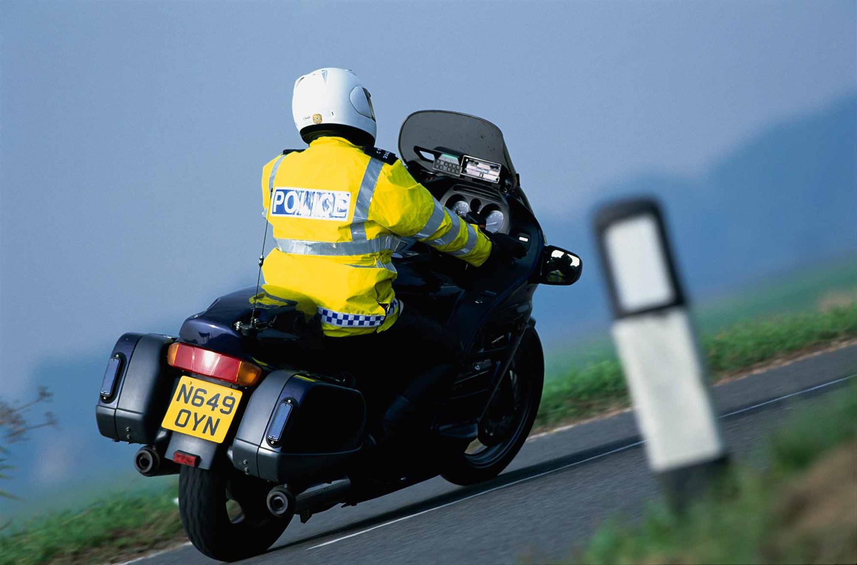 A police motorcyclist in action A police motorcyclist in action