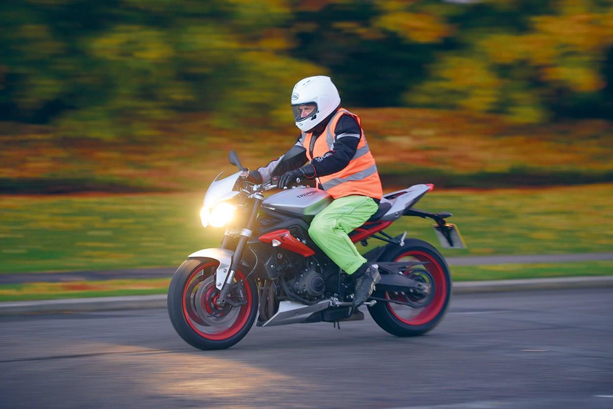 A Triumph Street Triple riding in winter A Triumph Street Triple riding in winter