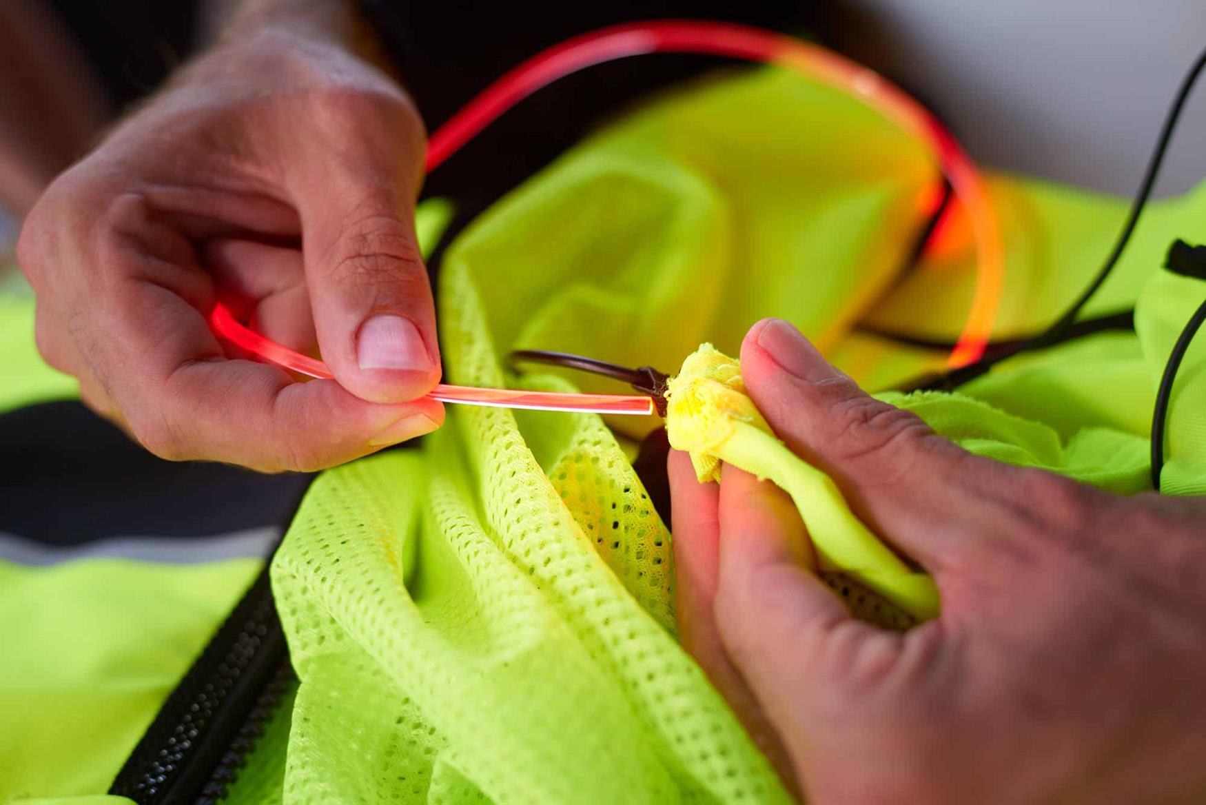 Feed the LED tubes through pockets in the garment Feed the LED tubes through pockets in the garment