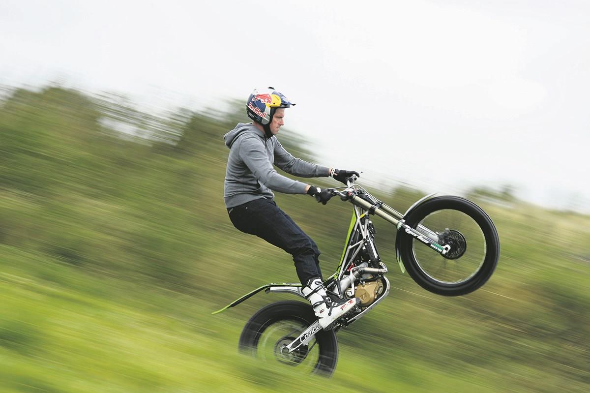 Lampkin pulls a wheelie on a Vertigo trials bike Lampkin pulls a wheelie on a Vertigo trials bike