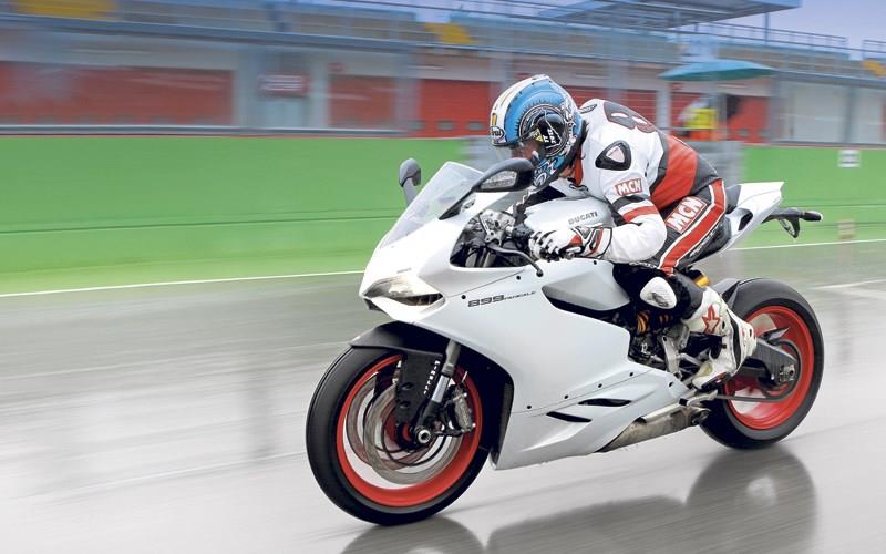 MCN's Adam Child in full tuck on the Ducati 899 Panigale MCN's Adam Child in full tuck on the Ducati 899 Panigale