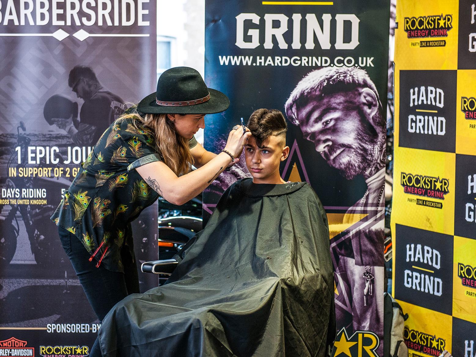 A barber trimming a haircut at BarbersRide A barber trimming a haircut at BarbersRide