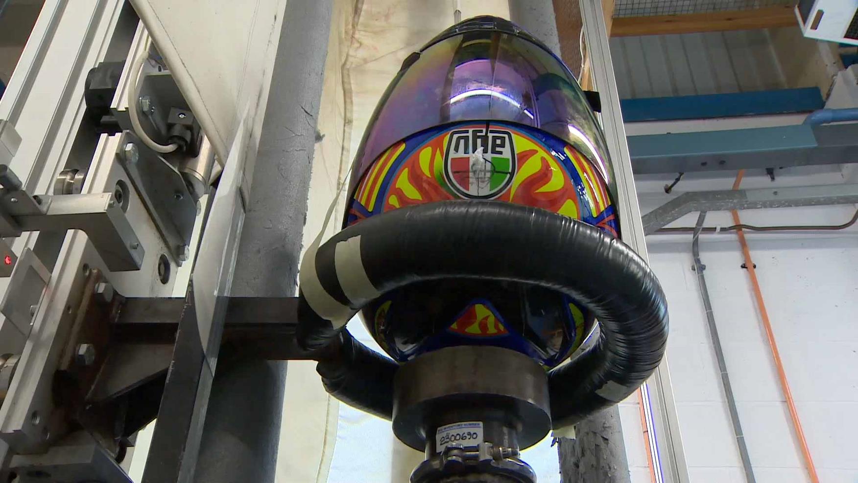 A fake crash helmet on a testing rig A fake crash helmet on a testing rig