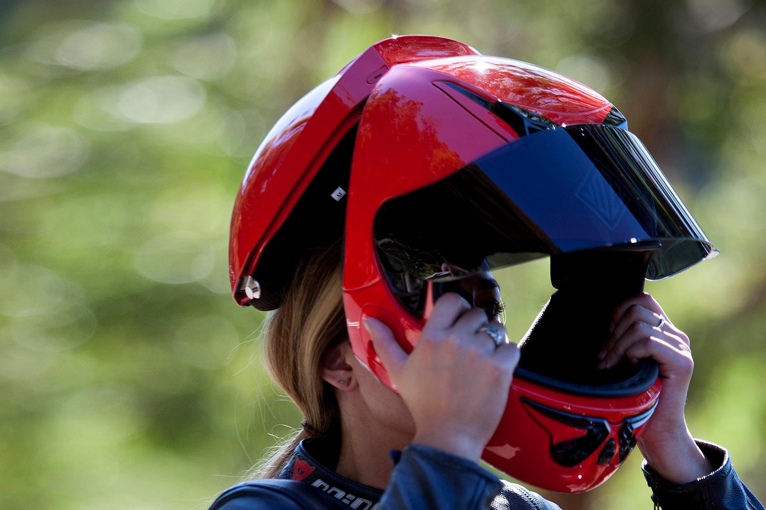 Putting on a Vozz RS helmet Putting on a Vozz RS helmet