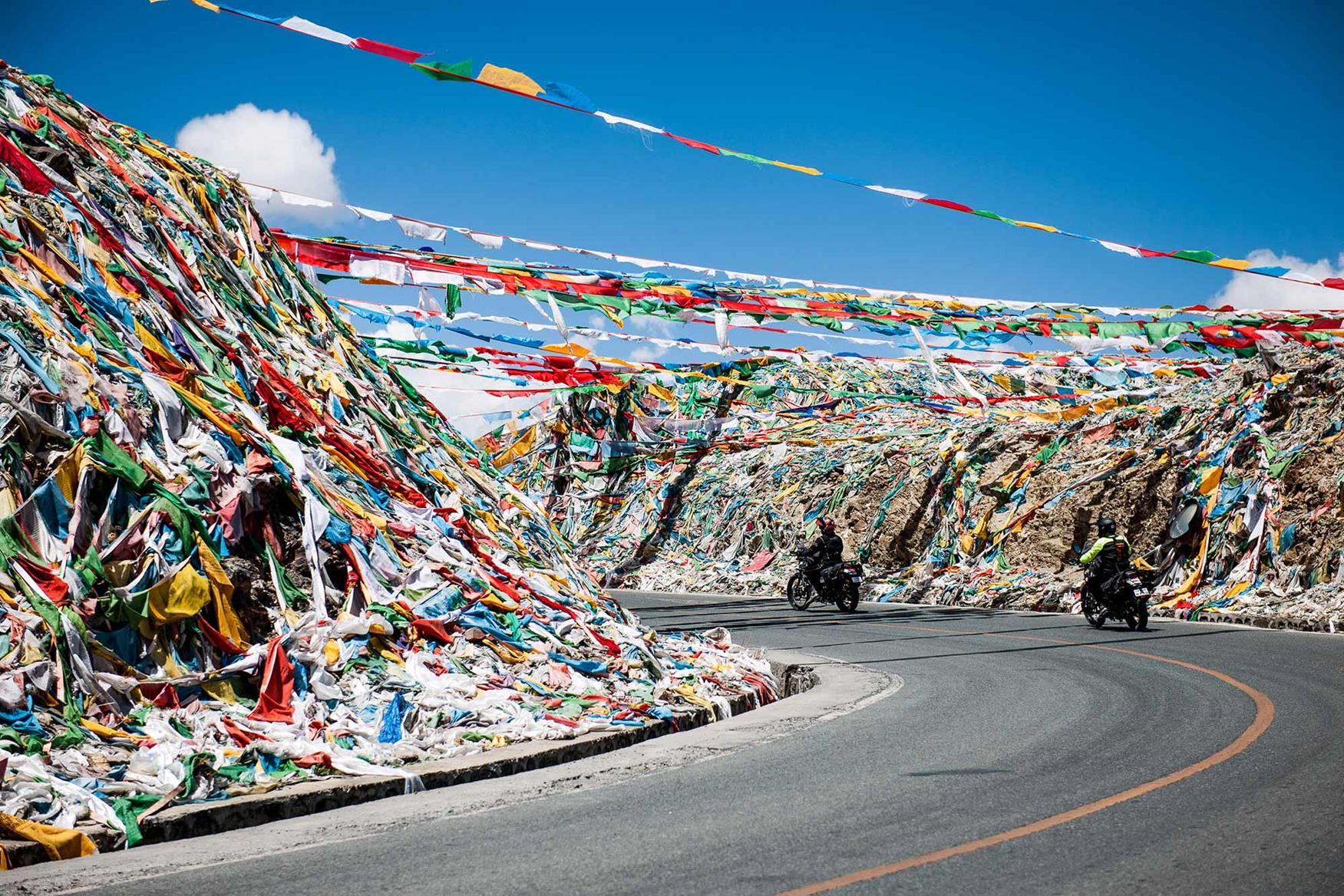 Prayer flags line the road Prayer flags line the road