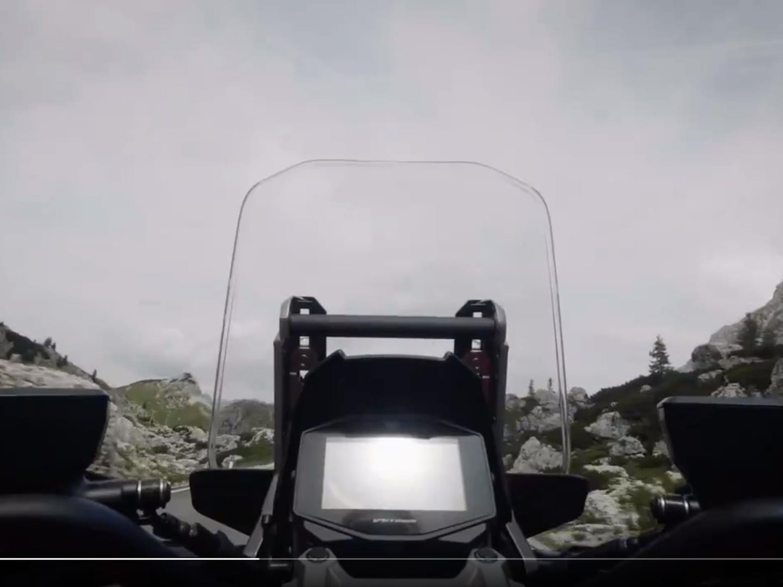 We can clearly see the Suzuki V-Strom's instrument screen and tall windscreen We can clearly see the Suzuki V-Strom's instrument screen and tall windscreen