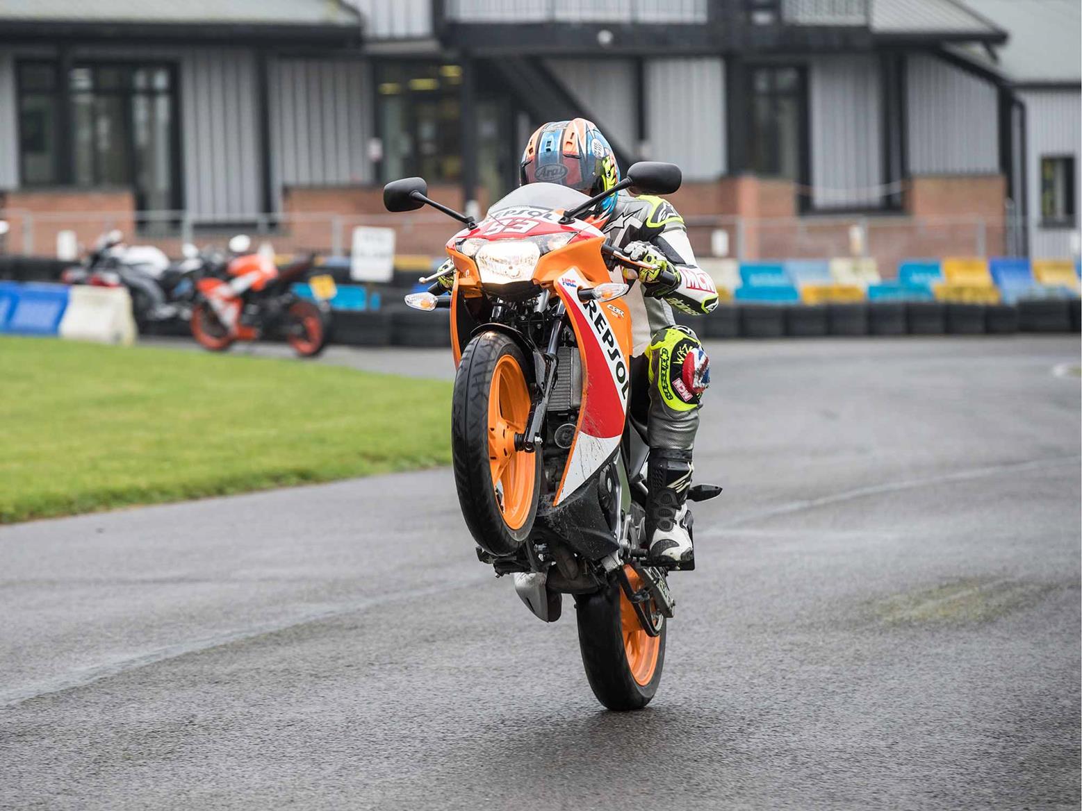 Popping a wheelie on the Honda CBR125R Popping a wheelie on the Honda CBR125R