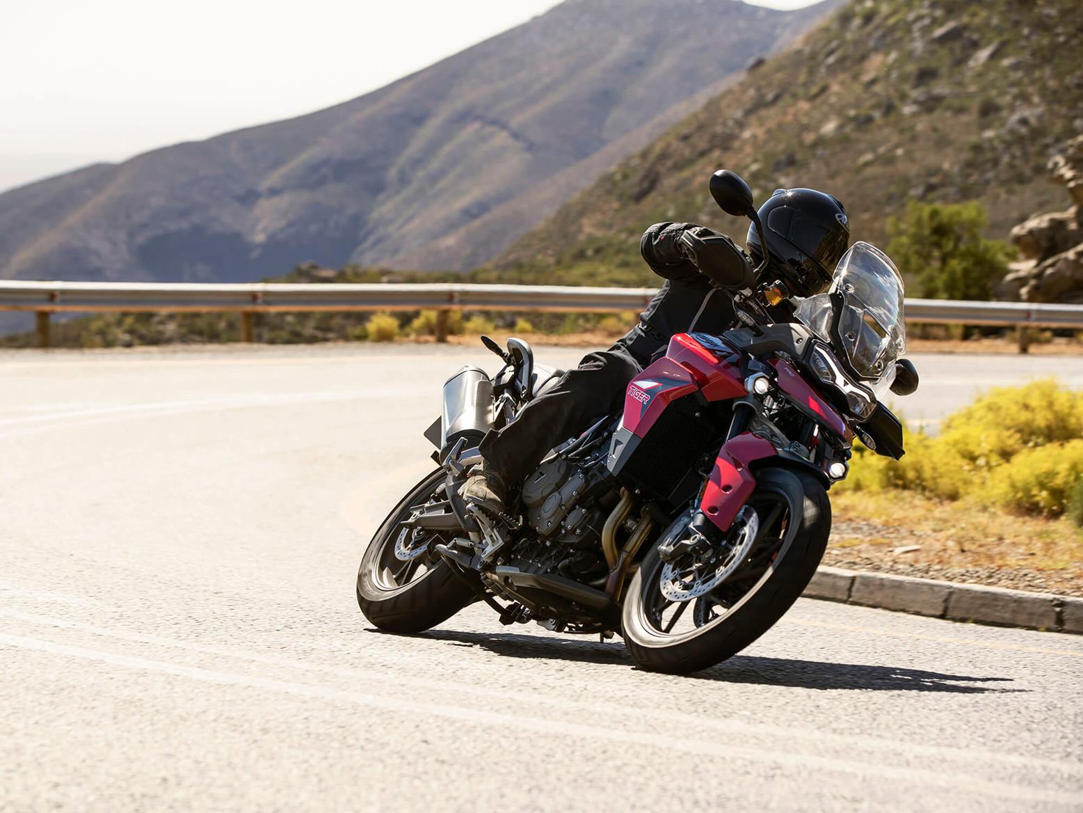Triumph Tiger 900 GT Pro cornering on road Triumph Tiger 900 GT Pro cornering on road