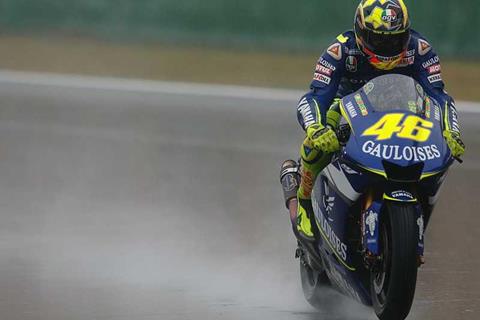 Soaked Rossi takes win