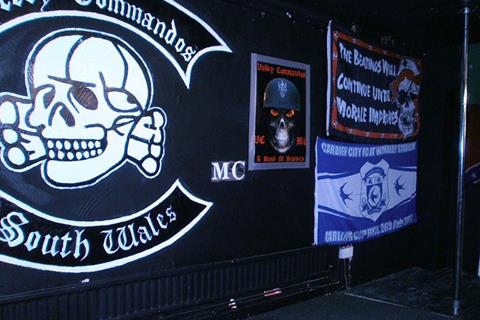 Mock KKK lynching in front of motorcycle club’s crest