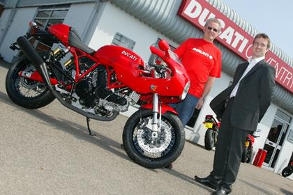 Roy Osbourne collects his prize Ducati GT1000 from Ducati UK’s Tim Maccabee at Ducati Coventry