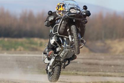 Charley Boorman takes the chance for a sneaky wheelie