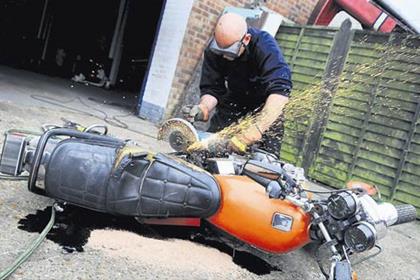 The tatty but classic Kawasaki Z550 was butchered with an angle grinder after officers found it dumped