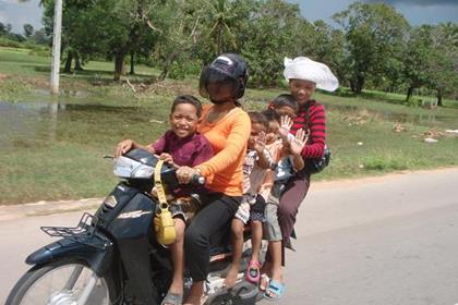 Count the number of legs. 6 up on a bike. We keep being told to "save the planet" by travelling with more than one person in a car or on a bike. I think this is the ultimate in environmentally sound travel!