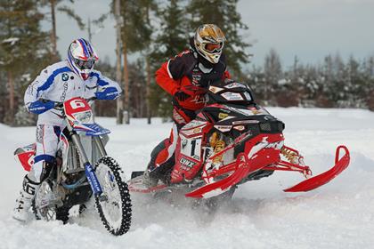 BMW G450X takes on snowmobile