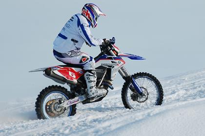 BMW G450X takes on snowmobile