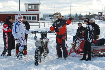 BMW G450X takes on snowmobile