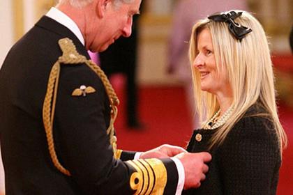 Maria Costello receives her MBE. Pic courtesy of PA Photos