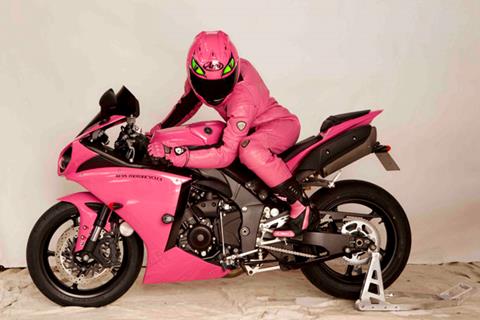 A pink Cat on an R1 at the TT