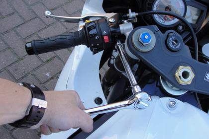 Rotating the clutch lever to a lower position