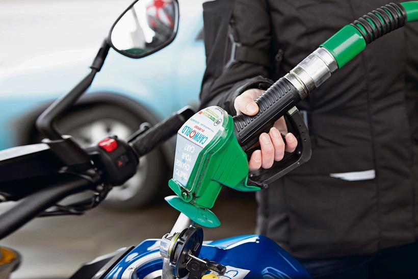 Filling a motorbike with petrol