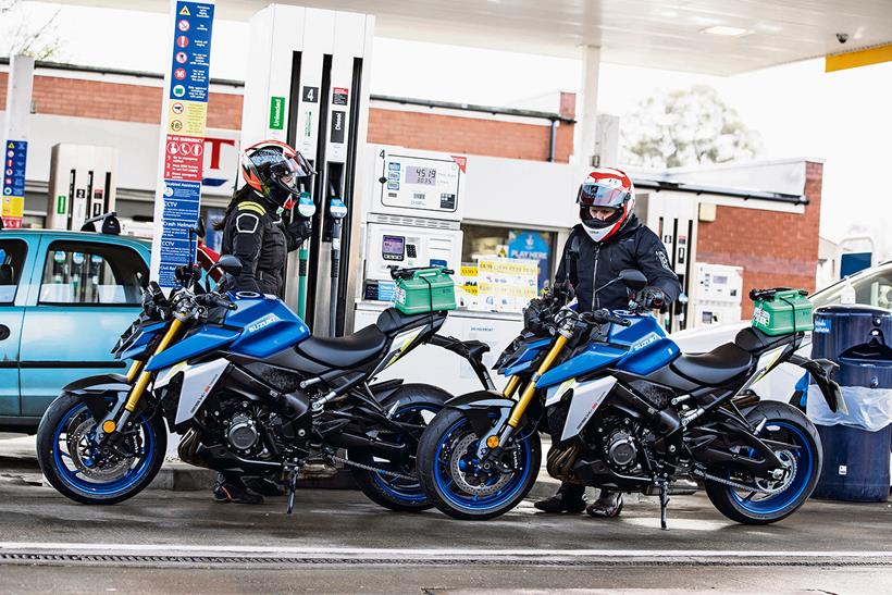 Filling up petrol motorcycles on a forecourt