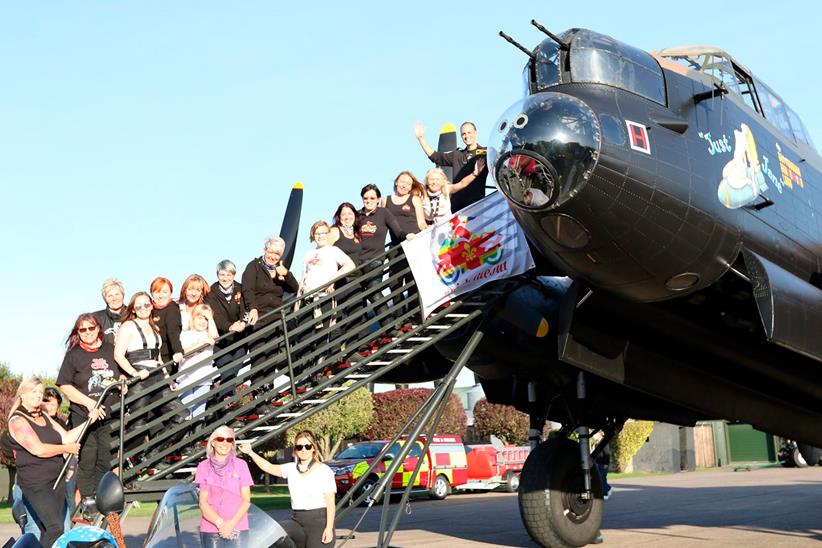 Some of the Girlsrideout group pose with a Lancaster Bomber