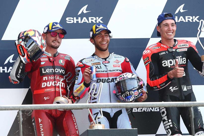 Enea Bastianini, Jack Miller and Aleix Espargaro celebrate on the podium