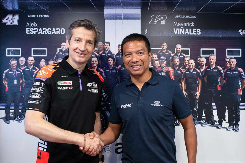 Massimo Rivola (left) and Razlan Razali (right) shake hands on satellite Aprilia deal;