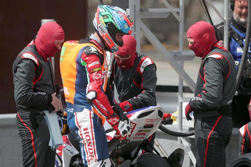 Glenn Irwin retires his Honda during the second pit stop of the Senior TT - Picture by Stephen Davison