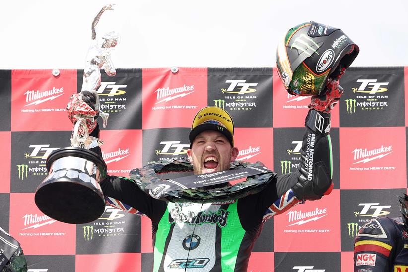 Peter Hickman celebrates on the podium after winning the 2022 Senior TT - Picture by Stephen Davison