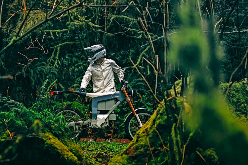 Cake electric bike being ridden in forest