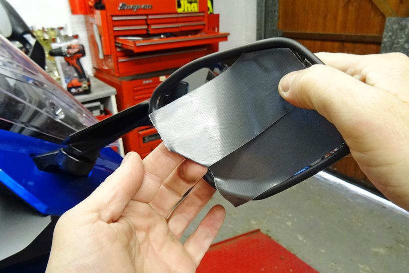 Covering motorcycle mirrors with tape