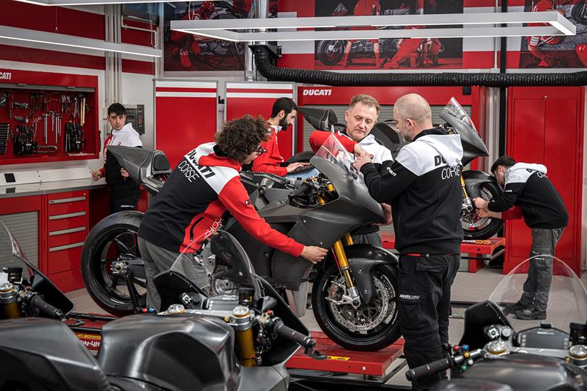 Ducati technicians working on the MotoE bike