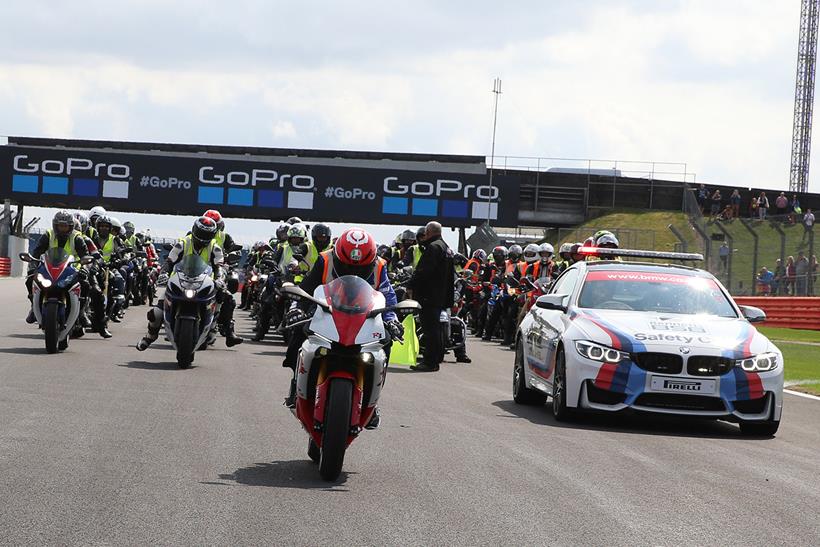 Attendees take part in a parade lap of the circuit at Day of Champions 2019