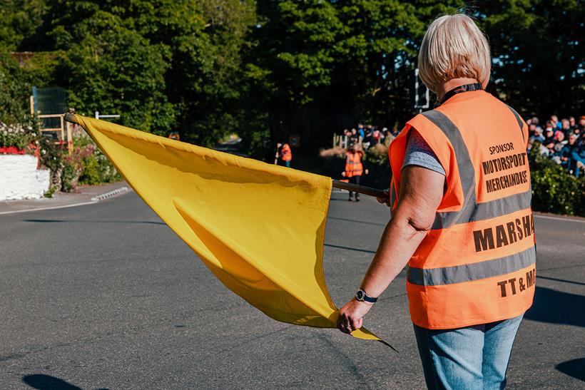 Marshal waves a yellow flag