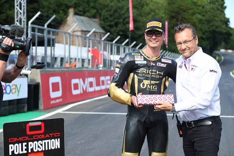 Bradley Ray is handed a Omologato watch by Series Director Stuart Higgs after taking pole