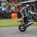 Peter Hickman pulls a wheelie to celebrate victory at Brands Hatch