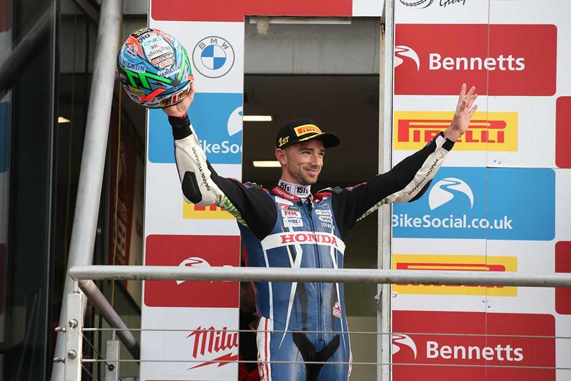 Glenn Irwin celebrates his victory at Brands Hatch on the podium